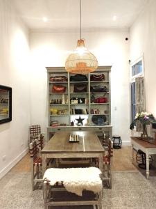 a dining room with a table and some chairs at Hotel Costa Rica in Buenos Aires