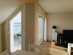 a living room with a view of the ocean at Oliveira de Portosín in Portosin