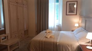 Postel nebo postele na pokoji v ubytování Hotel Corallo