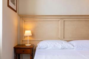 Postel nebo postele na pokoji v ubytování Hotel Corallo