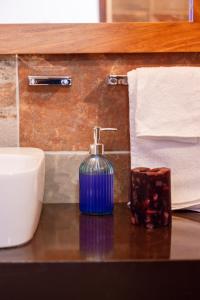 a bottle of soap on a counter in a bathroom at CASA FORTALEZA in Oaxaca City