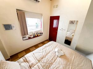 Postel nebo postele na pokoji v ubytování La Casa Di Dicembre 36B Trần Hưng Đạo