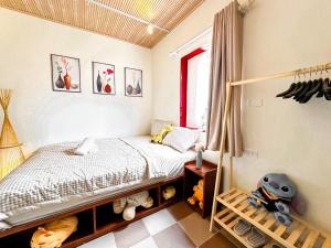 Postel nebo postele na pokoji v ubytování La Casa Di Dicembre 36B Trần Hưng Đạo