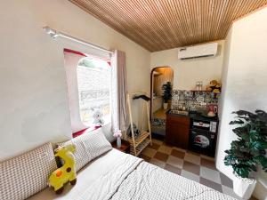 Postel nebo postele na pokoji v ubytování La Casa Di Dicembre 36B Trần Hưng Đạo