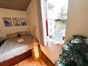 Postel nebo postele na pokoji v ubytování La Casa Di Dicembre 36B Trần Hưng Đạo