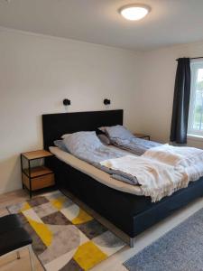 Postel nebo postele na pokoji v ubytování Ny rorbu på kaikanten