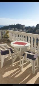 a white table and two chairs on a balcony at Pipo apartmentS in Ulcinj