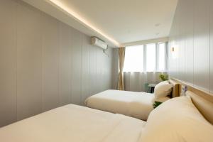 Katil atau katil-katil dalam bilik di KeTangJian Aparthotel