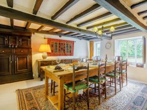 a dining room with a large wooden table and chairs at 5 Bed in Broughton Beck SZ587 in Spark Bridge