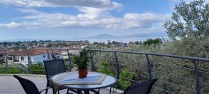 a table and chairs on a balcony with a view at View House in Agria