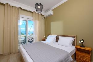Posteľ alebo postele v izbe v ubytovaní Fani's Beach House
