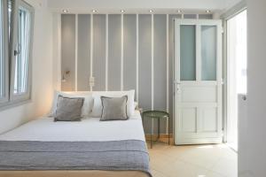 Posteľ alebo postele v izbe v ubytovaní Romantica Suites