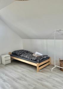 a bedroom with a bed in the corner of a room at Domek Na Wzgórzu in Dubiecko +13 photos