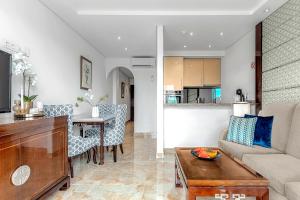 a living room with a couch and a table at Ocean View Apartment in Albatros Golf del Sur in San Miguel de Abona