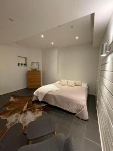 a bedroom with a bed and a table and chairs at Säynätsalo Apartment in Säynätsalo