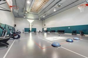 a gym with a basketball hoop and a basketball court at Sea Colony Canal II in Bethany Beach