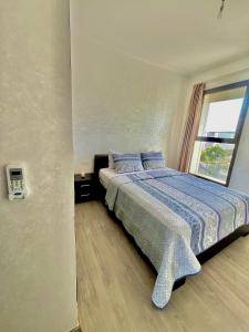 Кровать или кровати в номере Tamraght golf sea view , pool, beach access