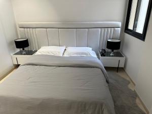 Ένα ή περισσότερα κρεβάτια σε δωμάτιο στο Luxury two bedrooms apartment jardin carthage