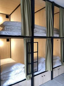 a group of bunk beds in a room at TREND HOUSE Apartments & Hostel in Vinnytsya