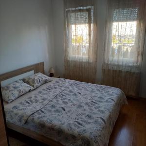 Postel nebo postele na pokoji v ubytování Apartman MG