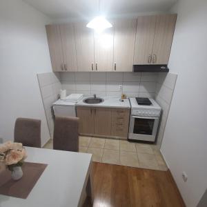 Kuchyň nebo kuchyňský kout v ubytování Apartman MG