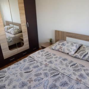 Postel nebo postele na pokoji v ubytování Apartman MG