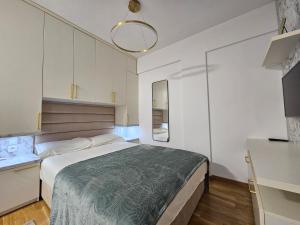 Postel nebo postele na pokoji v ubytování Studio apartman Gold