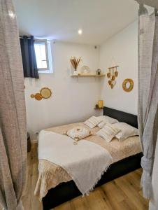 Posteľ alebo postele v izbe v ubytovaní Appartement cosy proche du port