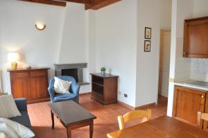 a living room with a couch and a table at Montecasciano - Girasole in Capranica