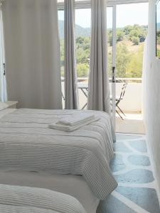 Ένα ή περισσότερα κρεβάτια σε δωμάτιο στο BY THE SEA ROOMS, AVLAKI