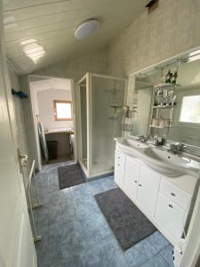 a large bathroom with a sink and a shower at Maison avec jardin Orléans métropole in Fleury-les-Aubrais +44 photos