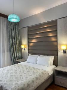 מיטה או מיטות בחדר ב-Maria Apartments