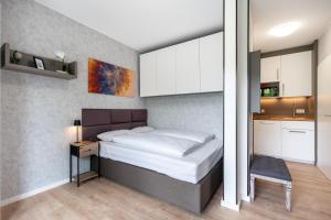 Katil atau katil-katil dalam bilik di SmartLiving Boardinghouse Bielefeld - 24h Check In