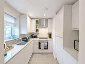Η κουζίνα ή μικρή κουζίνα στο Roseland Apartment 2
