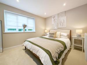 Ένα ή περισσότερα κρεβάτια σε δωμάτιο στο Roseland Apartment 2