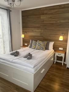 Een bed of bedden in een kamer bij Rodzinna Ostoja