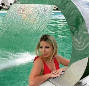 a woman sitting on a raft in the water at Mirage in Bukovel