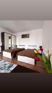 a bedroom with a large bed and a desk at "Гостевой дом Анны" по улице Абая, 165 in Taldykorgan
