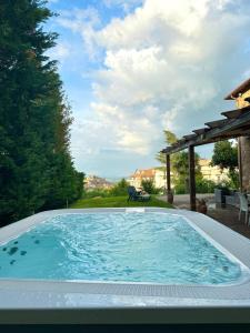 a large swimming pool in a backyard at Antica Quercia Villa & Spa in Chianciano Terme