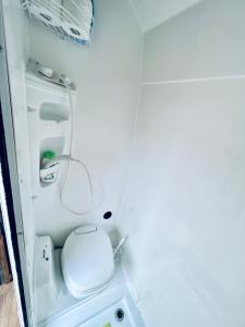 a small bathroom with a toilet in an rv at On Road- feel freedom with campervan! in El Guincho
