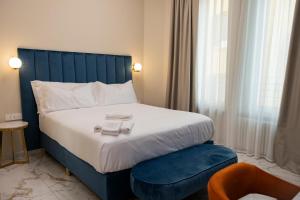 Postel nebo postele na pokoji v ubytování Vespucci Palace Roma