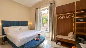 Postel nebo postele na pokoji v ubytování Vespucci Palace Roma