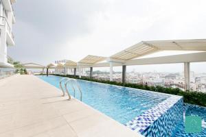 a swimming pool on the roof of a building at The Octagon Premium Suite - Ipoh in Ipoh