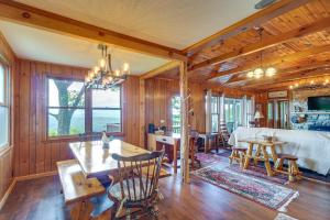 a dining room and living room with a table and chairs at Tallassee Family Home with Stunning Smoky Mtn Views in Tallassee