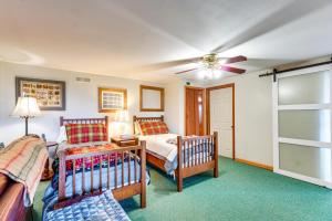 a bedroom with two beds and a ceiling fan at Tallassee Family Home with Stunning Smoky Mtn Views in Tallassee