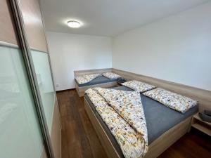 Postel nebo postele na pokoji v ubytování Apartmány Strážnice