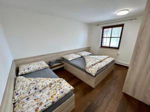 Postel nebo postele na pokoji v ubytování Apartmány Strážnice