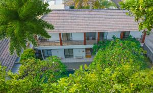 an aerial view of a house with trees at Dirga's House Sanur View by EPS in Sanur