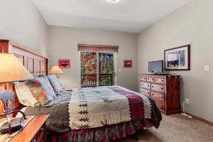 a bedroom with a bed and a dresser and a television at Lookout Ridge 45 by Great Western Lodging in Dillon +24 photos