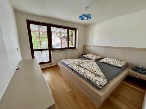 Postel nebo postele na pokoji v ubytování Apartmány Strážnice